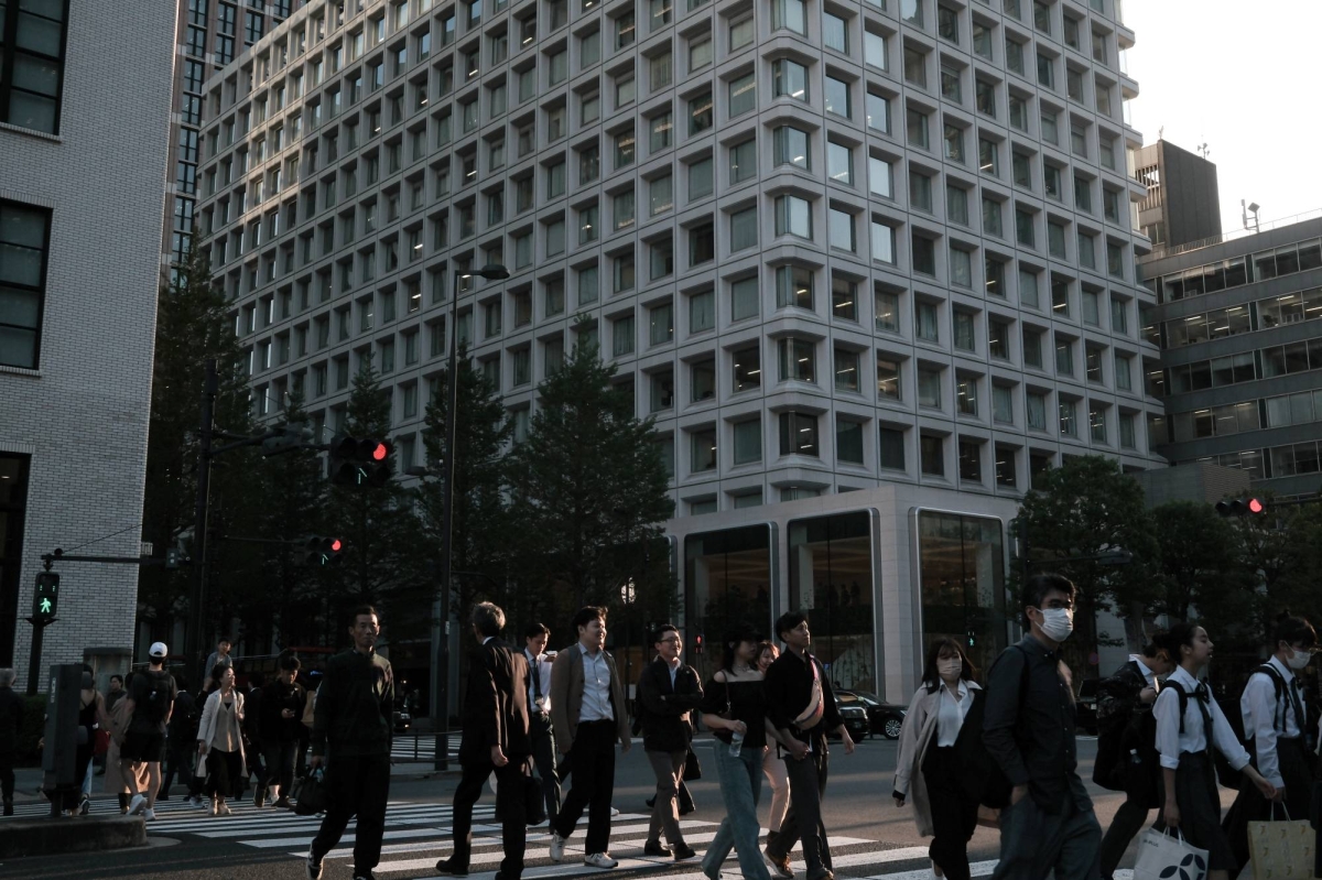 Record base pay gains keep door open for BOJ hike