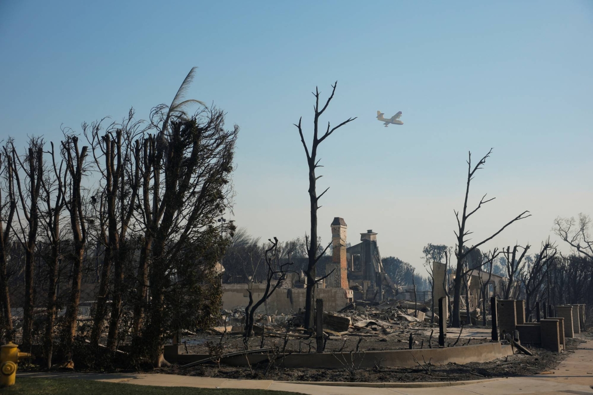 Explosive Los Angeles wildfires rage on even as fierce winds ebb