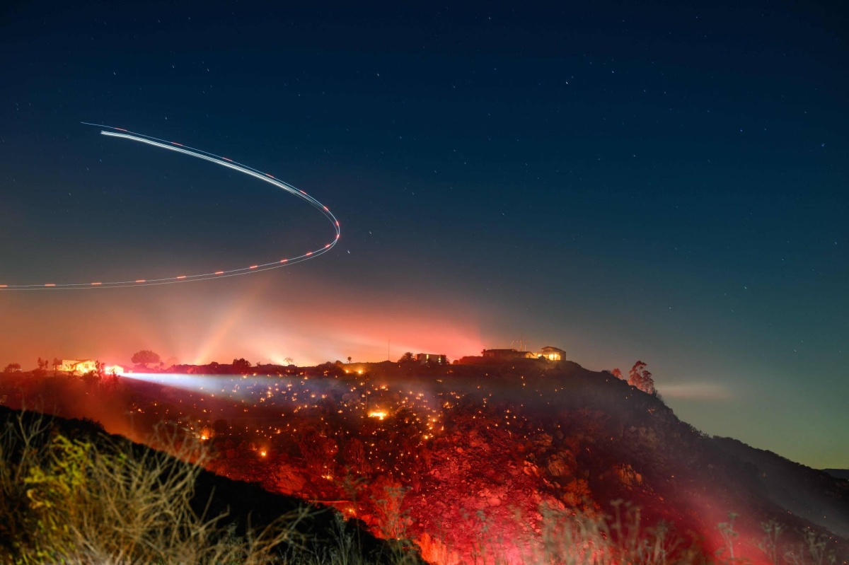 Fire-scarred Los Angeles to face dry winds with promise of weekend rain