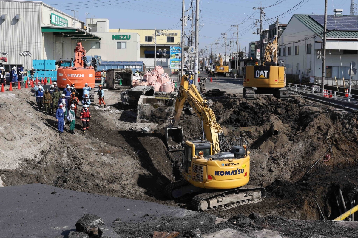Slope built to reach man trapped in sinkhole in Saitama