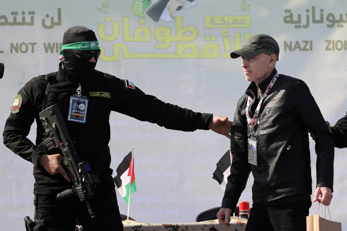 Hamas stages Gaza beach handover as Israeli hostages freed
