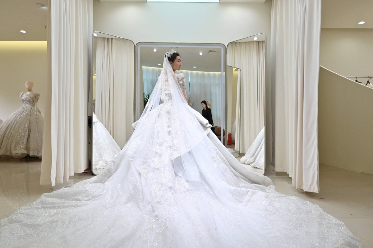 China adviser pushes to lower legal marriage age to 18 to boost birthrate